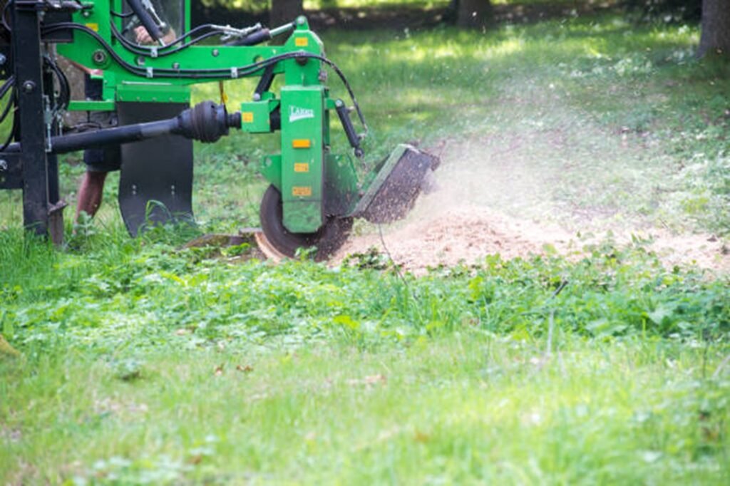 Stump grinding equipment removing a tree stump from a residential yard in El Monte, CA